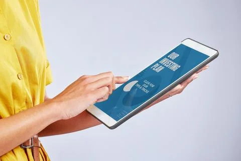Hands, digital tablet and closeup of a woman in studio reading an ebook on the Stock Photos