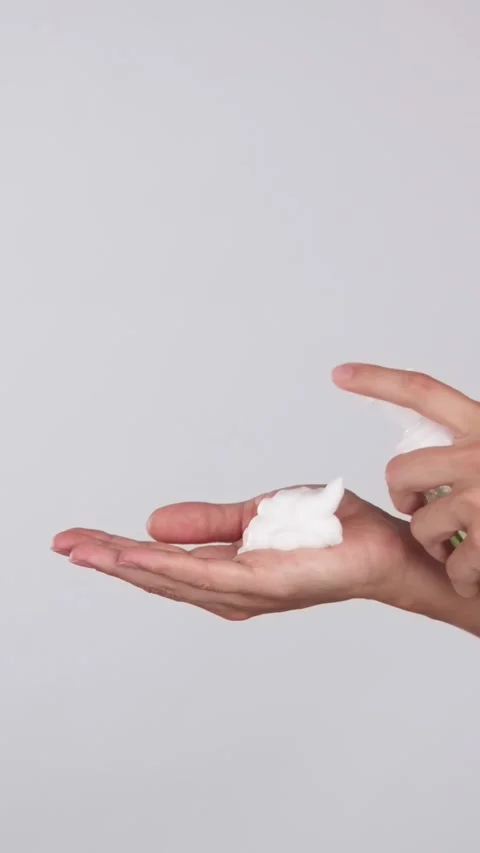 Hands Dispensing Cleansing Foam from Bottle Stock Footage 319135803
