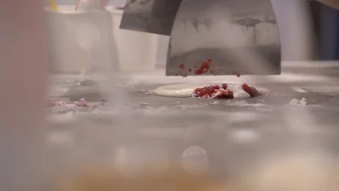 Hands in disposable gloves cook fried ice cream with raspberry Stock Footage 128268405