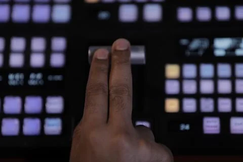 Hands on dissolve of Switcher buttons in studio TV station, 스톡 사진