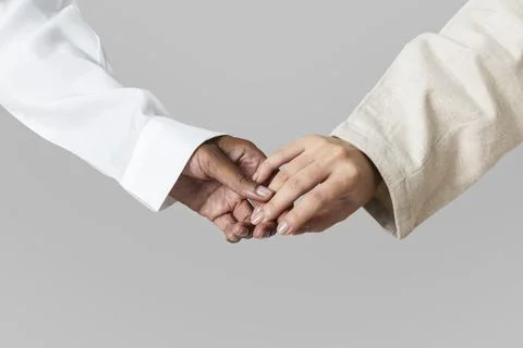 Hands of diversity coming together in unity Stock Photos