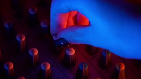 Hands of a DJ Man Working with a DJ Mixer Close-up Stock Footage 260532554