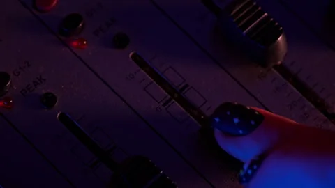 Hands of a DJ Man Working with a DJ Mixer Close-up Stock Footage 260803627