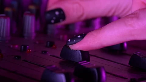 Hands of a DJ Man Working with a DJ Mixer Close-up Stock Footage 260937761