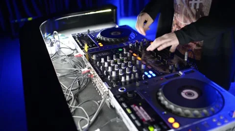 Hands Of Dj Tweak Controls On Record Deck In Night Club. Turntable, Mixer, Plate Stock Footage 61064735
