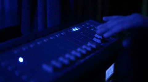 Hands of DJ tweak various track controls on dj's deck Stock Footage 61795049