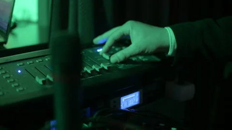 Hands of DJ tweak various track controls on dj's deck Stock Footage 61795096