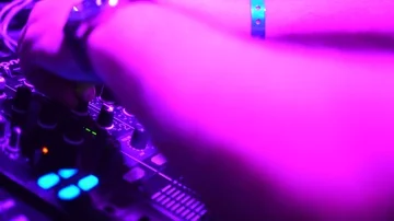 Hands of DJ tweak various track controls on dj's deck Stock Footage 85688244