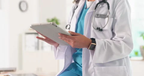 Hands, doctor and reading in office with tablet, research and email referral for Stock Footage 342025367