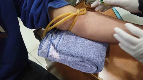 Hands of doctor taking samples of blood tubes for analysis Stock Footage 167304899