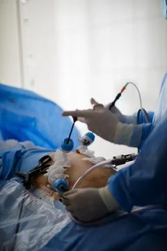 Hands of doctors performing laparoscopy operations Stock Photos