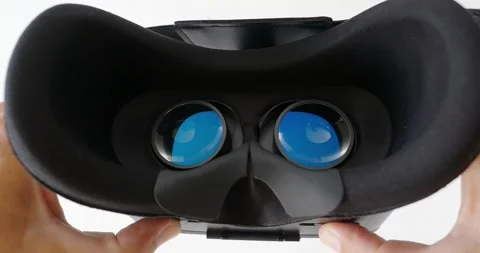 Hands does lens adjustment in virtual reality glasses. Set distance for eye. Stock Footage 168450640