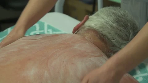 Hands doing masotherapy on a patient Stock Footage 186897676
