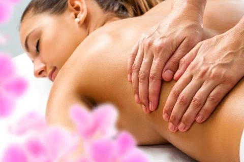 Hands doing Relaxing back massage. Stock Photos