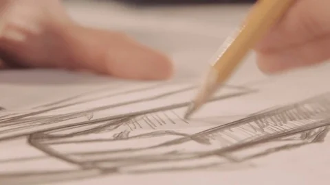 Hands draw with a pencil. Designer draws a line on the paper. Close-up Stock Footage 73291633