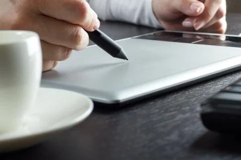 Hands drawing on graphic tablet Stock Photos
