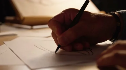 Hands drawing a sketch of a model in a dark light Stock Footage 209659305