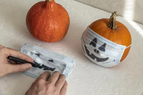 Hands draws Halloween face Stock Photos