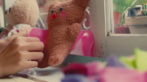 Hands Dressing a Customizable Bear at Build-A-Bear Workshop - Close Up Stock Footage 296278841