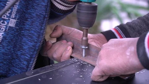 Hands Drill into Metal Stock Footage 315787399