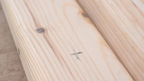 Hands drilling a small hole in a pine wooden plank Stock Footage 88343804