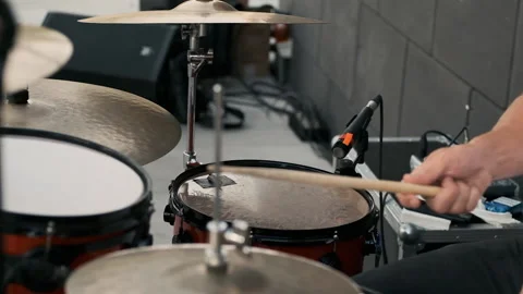 Hands of a drummer beating sticks on an instrument. Performs a piece of music Stock Footage 196877189