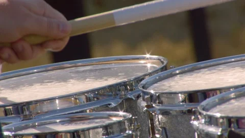 Hands of drummer playing in slow motion at football game Stock Footage 102106044
