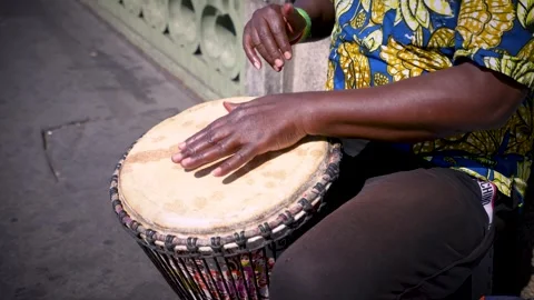 Hands Drumming on Traditional Djembe Percussion Instrument in Bright Sunlight Video stock 343631276