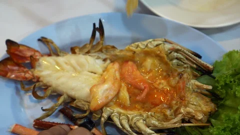 Hands eating large grill river prawn Thai luxury seafood Stock Footage 127758835