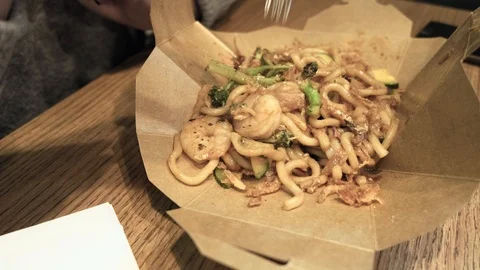 Hands eating noodles Stock Footage 98216681