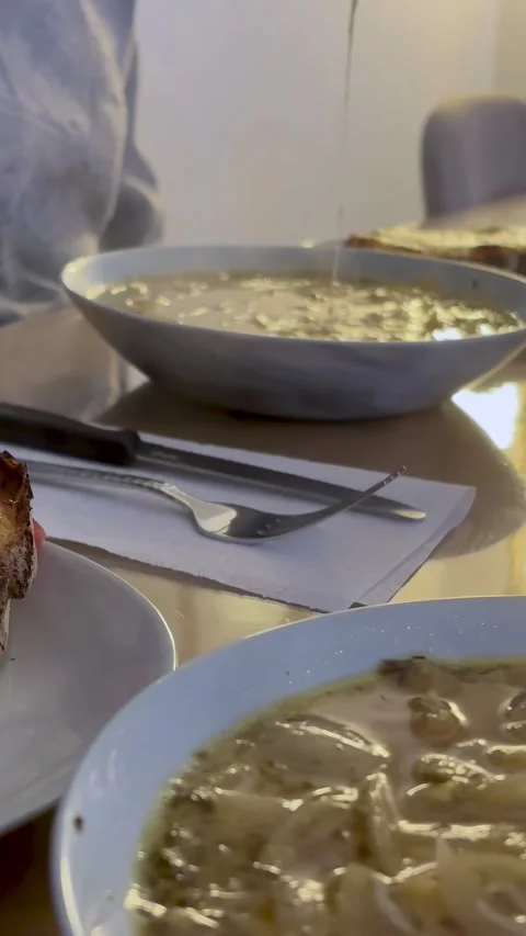 Hands Eating Shared Dinner In Warm Low Light 4K Stock Footage 321198947