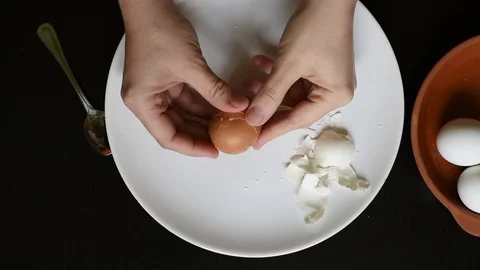Hands off the egg-shell of chicken eggs at home Stock Footage 96065166
