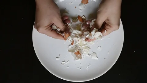 Hands off the egg-shell of chicken eggs at home Stock Footage 96188210