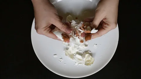 Hands off the egg-shell of chicken eggs at home Stock Footage 96376220