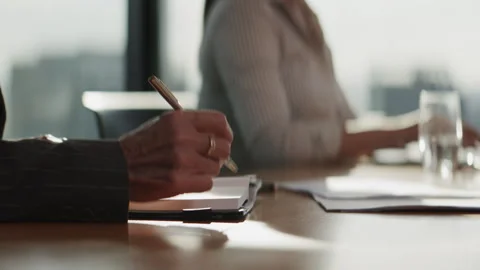 Hands of an Elderly businessman writing something in a notebook Stock Footage 264555291