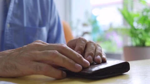 Hands of an elderly male cafe customer at a table waiting Stock Footage 281431807
