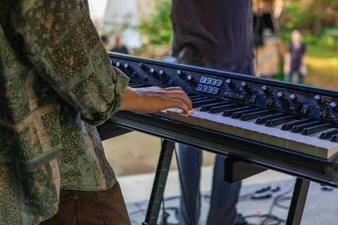 Hands of an electronic keyboard player Stock Photos