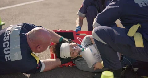 Hands, emergency oxygen and an emt team with a patient or victim on the street Stock-Footage 252641470