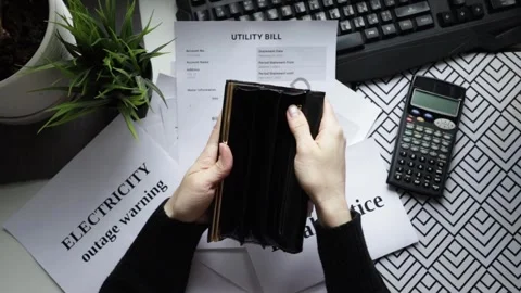 Hands with an empty wallet with utility bills, economy and energy cost plan.. Stock Footage 301948469