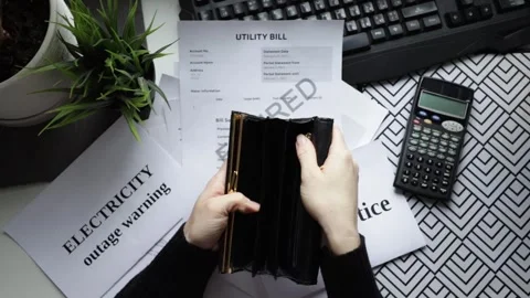 Hands with an empty wallet with utility bills, banking statement and overdu.. Stock Footage 304137787