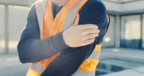 Hands, engineer and discomfort at site with pain, arm sprain and burnout of Stock Footage 345647557