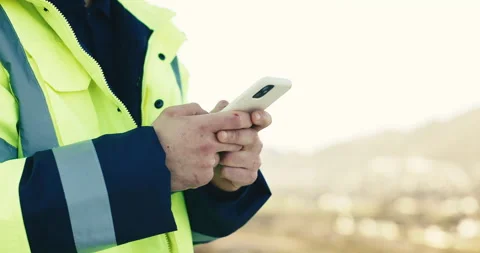 Hands, engineer and phone for online communication, construction or building Stock Footage 345571857