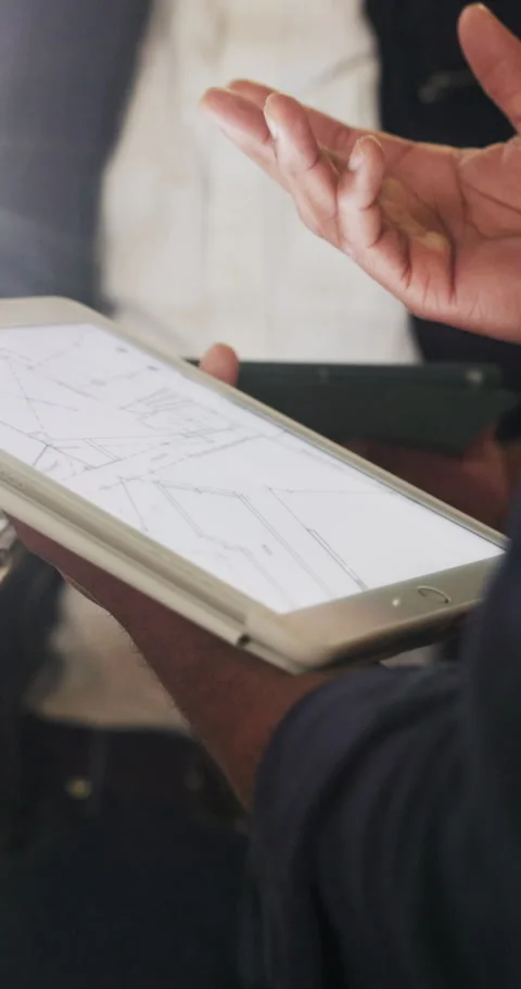 Hands, engineer and tablet screen at site with blueprint, design and Stock Footage 340599483