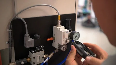 Hands of Engineer Fixing Machine with Wrench Stock Footage 124295859