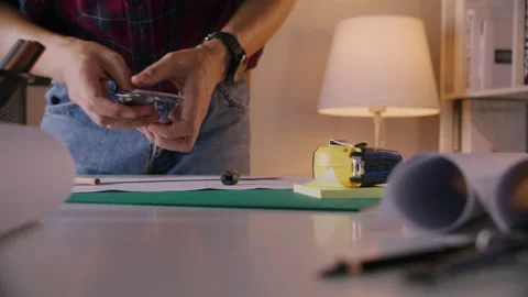 Hands of Engineer using vernier caliper to scale the black screw Stock Footage 170410424