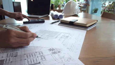 Hands of Engineer working on blueprint. Stock Footage 77894176