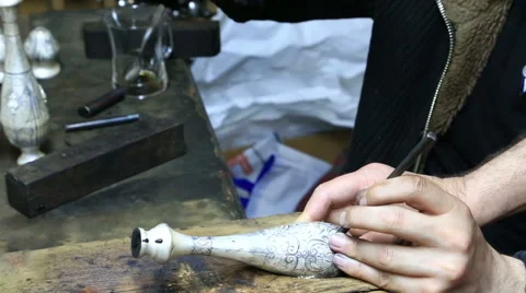 Hands of engraver working with silver vessel Stock Footage 54622723