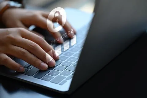 Hands entering pin code on laptop. User privacy security and protect personal 스톡 사진