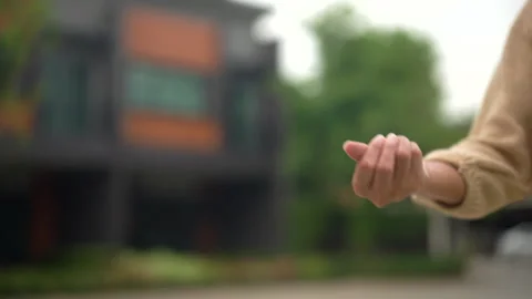 Hands of estate agent giving keys woman buying or rent new home walking to new. Stock-Footage 241997632