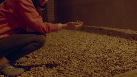 Hands examine pebbles closely, Closeup of person inspecting small stones Stock Footage 322925228